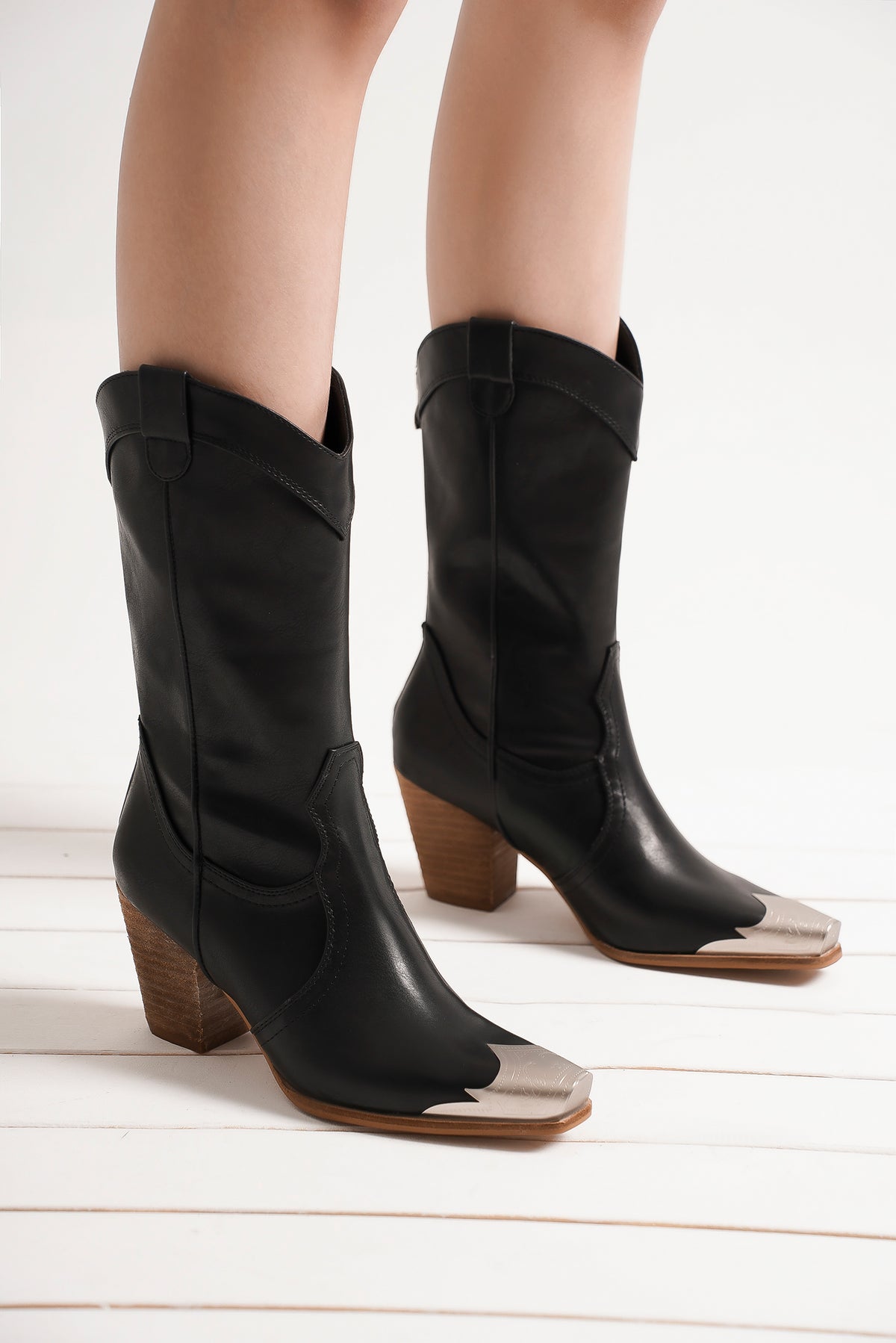 Chic black Western metal-toe ankle boots from Beast Fashion with a pointed silhouette and block heel, perfect for everyday wear and all-season style. A must-have in heeled boots.