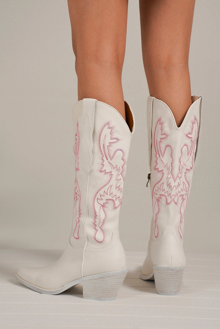 Back view of ADELA-02 Western Cowgirl Boots by Beast Fashion in white with pink stitching, showcasing stylish heeled boots perfect for parties or school. These trendy western cowgirl boots are back in stock and ideal for a chic western style.