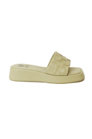 Side view of Beast Fashion CAMILA-01 Platform Woven Slide Sandals in light green, showcasing the modern woven design ideal for warm weather. These footbed sandals are a stylish choice for summer vacations.