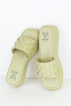 Beast Fashion CAMILA-01 Platform Woven Slide Sandals in light green, featuring a stylish woven upper, perfect for summer vacations with comfortable footbed for all-day wear. These flat sandals combine a flatform design with chic platform style.