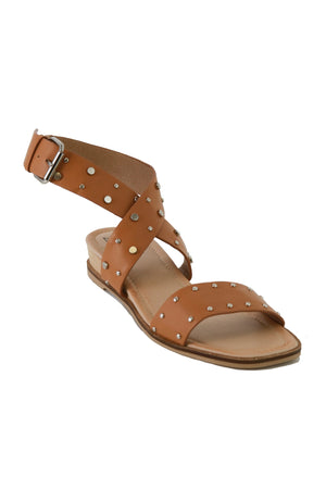 Chic HARPER-09 studded ankle strap sandals from Beast Fashion, shown in a camel hue with a crisscross strap design. These trendy flats are essential slide sandals to elevate your summer vacation wardrobe.