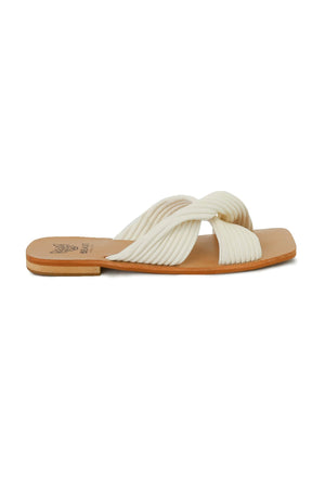 Elegant LANA-06 textured cross-strap sandals by Beast Fashion in chic off-white, designed for comfort and style. These flat sandals are perfect for summer vacations, offering a stylish slide sandal option for casual outings.