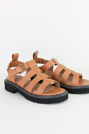 MILLIE-10 Gladiator Chunky Sole Sandals by Beast Fashion in camel color. Stylish and durable chunky sole sandals featuring multiple straps and an adjustable buckle. Perfect for summer vacations, these platform sandals are ideal for casual outings, making them a must-have in your shoe collection.