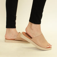 VICENTE-05 Slip-On Platform Sandals by Beast Fashion, featuring a close-up of the sandal in use. A stylish choice for summer and vacation outings, these slip-on platform sandals offer comfort for any casual occasion.