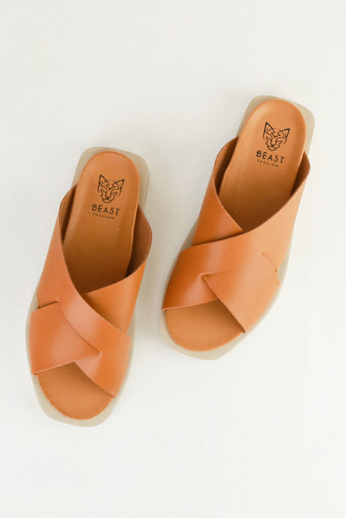 Top view of VICENTE-09 Crisscross Flat Sandals by Beast Fashion featuring a chic brown design. Perfect for summer vacation, these flat sandals have a cushioned footbed, ideal for casual outings and relaxing days. Shop now for comfortable slide sandals on sale.