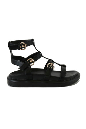Side view of Beast Fashion ZAYA-01 Gladiator Sandals in black. Ideal for summer outings, these stylish sandals combine comfort with a chic look. A must-have as flatform sandals and a great option for your summer vacation shoes.